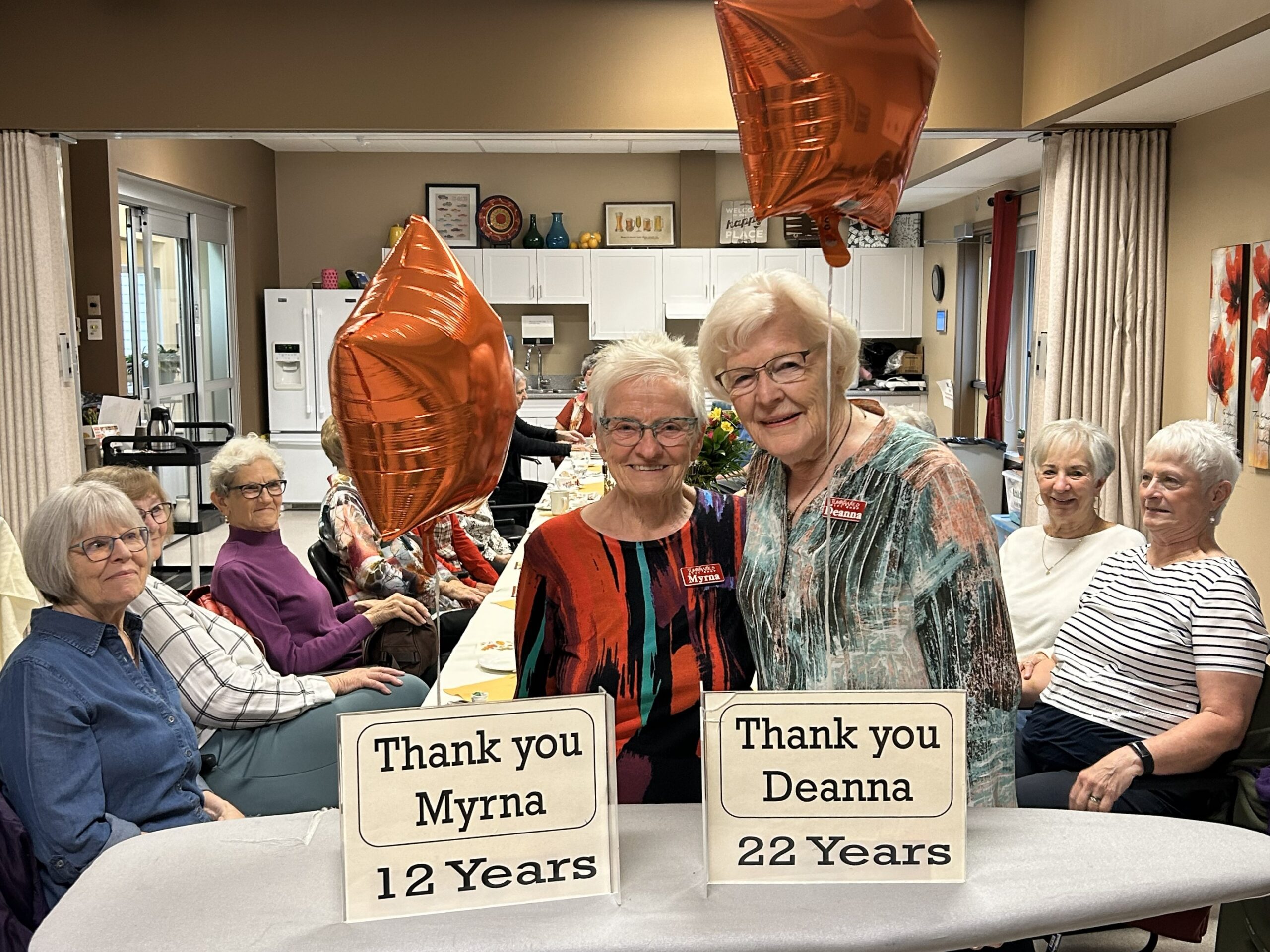 a group of Sherbrooke volunteers gathered with Myrna and Deanna